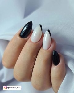 Simple White Black And White Stiletto Nails With Swooping Black French Tip