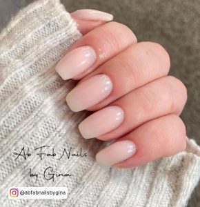 Simple White Glitter Nails Over Greyish White Sweater