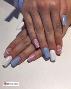 Sky Blue And White Acrylic Nails With Swirly Design Over Pink Base
