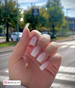 Sparkly Pink And White Ombre Coffin Nails With Road And Trees In Background
