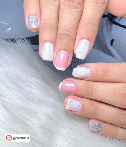 Sparkly Short White Nails Gel Polish With Silvery Glitters And White French Tips Over White Fur