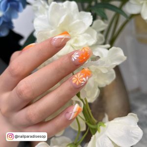 Spring Time Nail Designs Infront Of Flowers