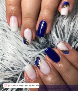 Square Tip Milky White Acrylic Nails With Royal Blue Feature Nail And Royal Blue And Gold Glitter On Milky White Nail Design