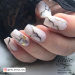 Squoval White, Gold, And Black Marble Nails With Ink Art