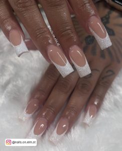 Stunning Ombre Nails White Glitter French Tips Placed Over Sliky White Fur