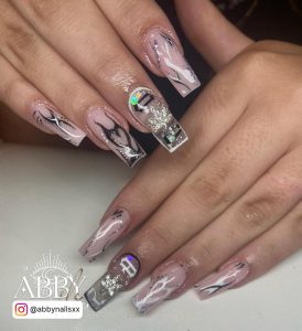 Trendy Black And White Coffin Nails With Glitter And Rhinestones On White Surface