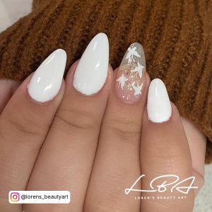 White Almond Nails With One Clear Almond Nail With White Stars