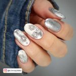 White And Silver Festive Oval Nails With Silver Glitter Feature Nails And Silver Designs On White Nails