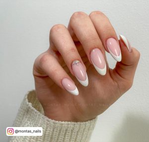 White French Almond Nails With Cute Diamond Design On One Finger