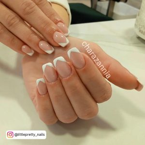 White French Tip Acrylic Nails Short On A Table