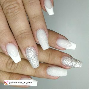 White French Tip Nails With White Base And Silver Glitter Feature Nails