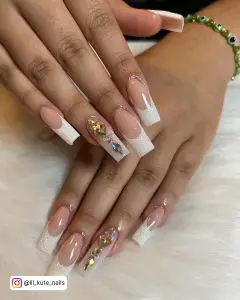White Glitter French Tips Placed Over White Fur