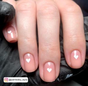 White Heart Nails With One Heart On Each Finger