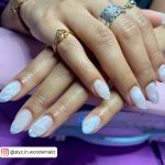 White Marble Acrylic Nails With Cute Rings