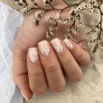 White Marble Nail Design With Tree Branches In Hand
