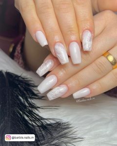 White Marble Nails On A Marble Table