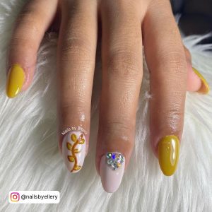 White Nails With Diamonds And Yellow Nail Paint On 3 Fingers