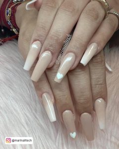 White Nails With Heart Design On A Nude Shade