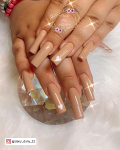 White Nails With Heart Design On Nude Nail Color
