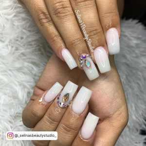 White Ombre Nails With Diamonds On Ring Finger