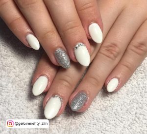 White Oval Nails With One Silver Glitter Feature Nail