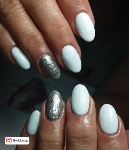 White Oval Nails With Silver Glitter Nail