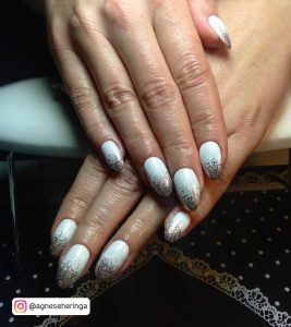 White Oval Nails With Silver Glitter Tips