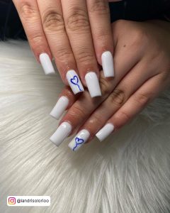 White Square Tip Nails With Royal Blue Heart Design On One Nail
