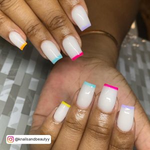 White Square Tip Nails With Yellow, Blue, Pink And Lilac Tips