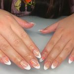 White Tip Almond Nails With Orange And Yellow Flower Designs