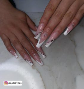 White Tip Coffin Nails With Diamonds In Slanting Order