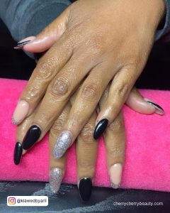 Acrylic Black And Silver Nails With Two Fingers In Nude Color