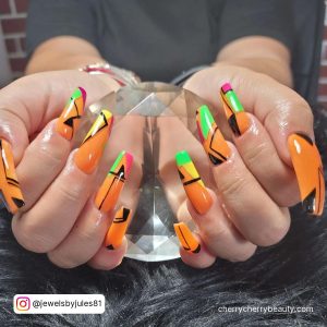 Acrylic Coffin Nail Ideas In Orange And Black