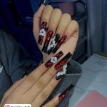 Acrylic Red And Black Nail Designs With White Flowers