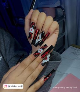 Acrylic Red And Black Nail Designs With White Flowers
