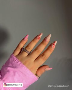 Almond Shape Nude And Pink Valentine Nails Ideas With Red Designs