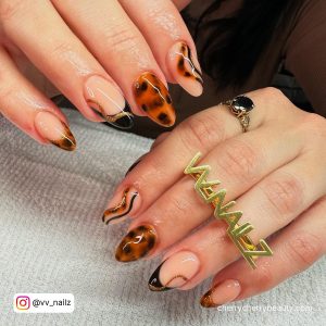 Almond Short Acrylic Nails With Brown And Black Patterns