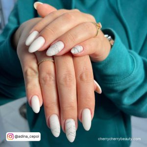 Almond White Matte Nails With Design On Two Fingers
