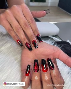 Black And Red Acrylic Nails With A Different Design On Each Finger