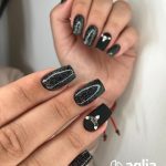 Black And Silver Nails With Design In Ring Fingernail