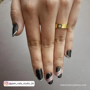 Black And Silver New Years Nails With Sparkly Tips