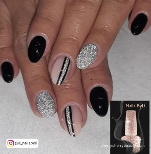 Black And Silver Sparkly Nails With Lines On Middle Finger