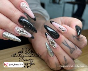 Black And Silver Stiletto Nails With Rhinestones
