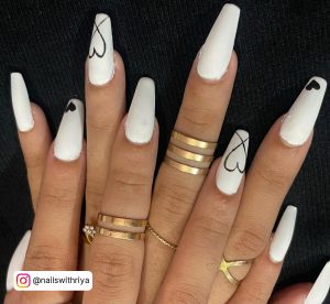 Black And White Long Nails With Hearts On 2 Fingers