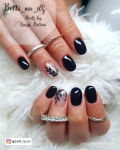 Black Nails With Silver Glitter Tips And Leaf Design