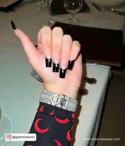 Black Tipped Acrylic Nails With 7 Written On It