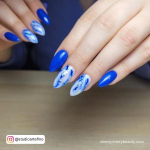 Blue And Silver Christmas Nail Designs In Stilleto Shape