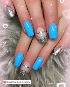 Blue And Silver Glitter Nails With Lines On Middle Finger
