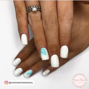 Blue And White Summer Gel Nails On White Surface