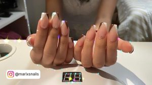 Brown And White Acrylic Nails In French Tip Design